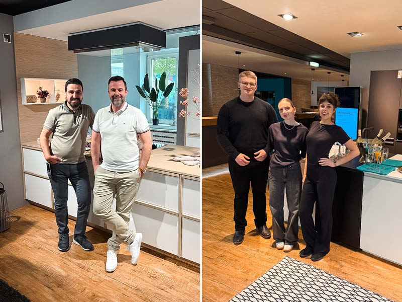 Mitarbeiter posieren in modernen Ausstellungsküchen während der Jubiläumsfeier SPECHT im Showroom.